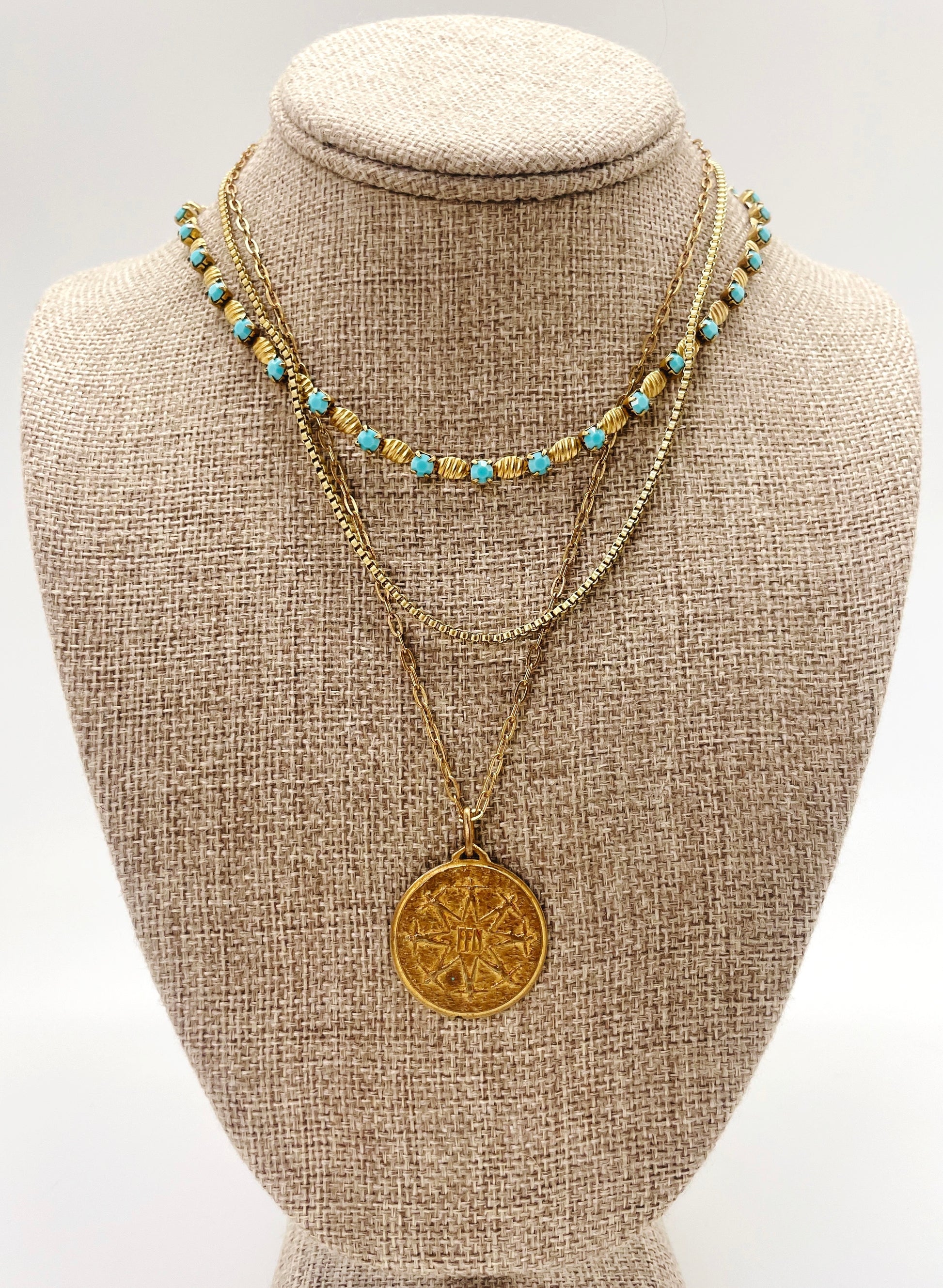 We paired our Baby Blue Necklace with our Box Chain and a coin necklace.